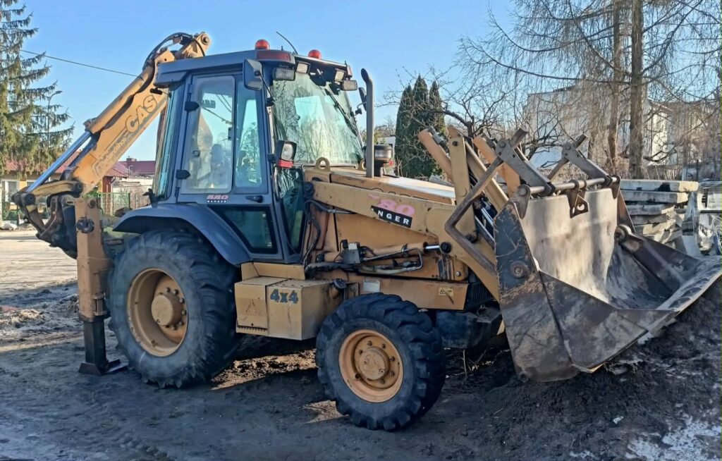 Zdjęcie przedstawia koparkę